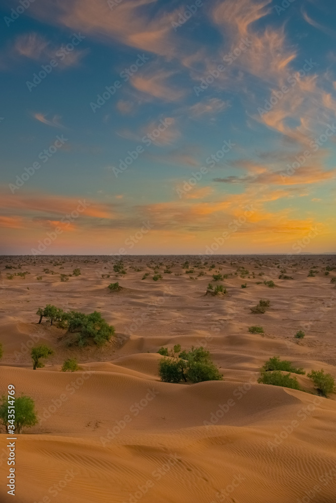 Amazing colorful evening view from the top of a erg dune, at the Sahara Desert in Mhamid, Zagora, Morocco Amazing colorful evening view from the top of a erg dune, at the Sahara Desert in Mhamid, Zagora, Morocco