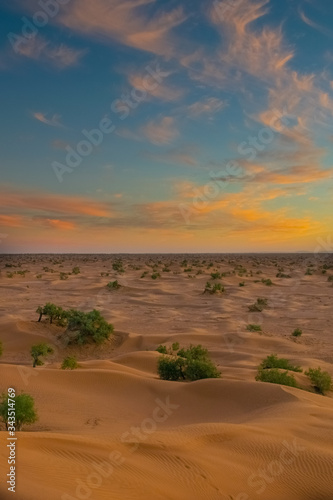 Amazing colorful evening view from the top of a erg dune, at the Sahara Desert in Mhamid, Zagora, Morocco