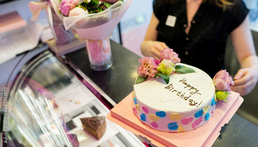 A beautifully decorated happy birthday cake with flowers, ordering a colourful cake, bakery, patisserie, cooking, background