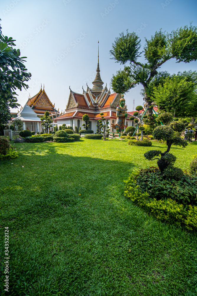 Bangkok, Thailand - January, 2020: The Temple of Dawn Wat Arun and a beautiful blue sky in Bangkok, Thailand Bangkok, Thailand - January, 2020: The Temple of Dawn Wat Arun and a beautiful blue sky in Bangkok, Thailand