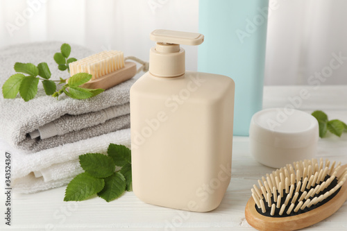 Composition with hair care products on wood table