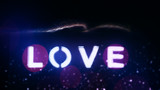 Glowing word love. Neon lighting effect. Blurred background.