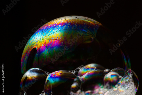 Soap bubbles on a black background. Closeup.