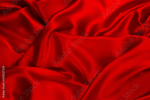 Red and orange silk or satin luxury fabric texture can use as abstract background.