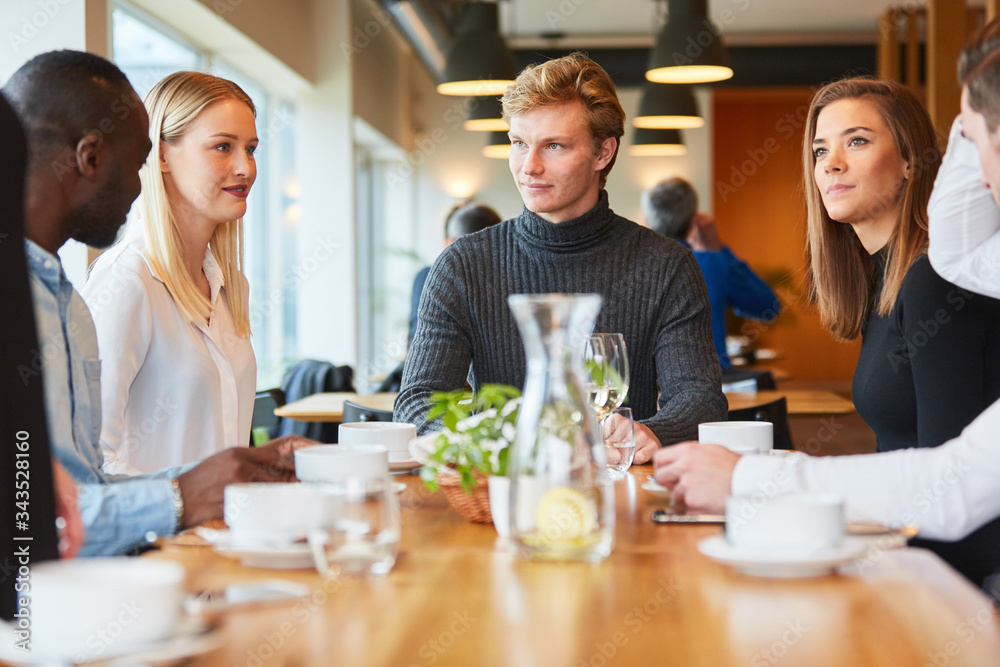 Group of friends having lunch together