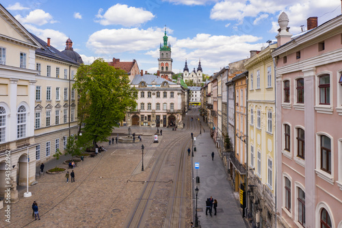 Aerial view on Market square, Dormition and Carmelite Church in Lviv, Ukraine from drone