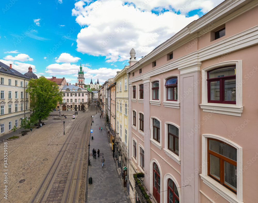 Fototapeta premium Aerial view on Market square, Dormition and Carmelite Church in Lviv, Ukraine from drone