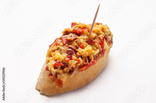  typical spanish food pintxo of scrambled eggs with vegetables