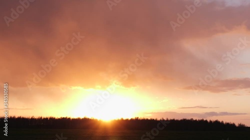 dark clouds red sun at sunset day