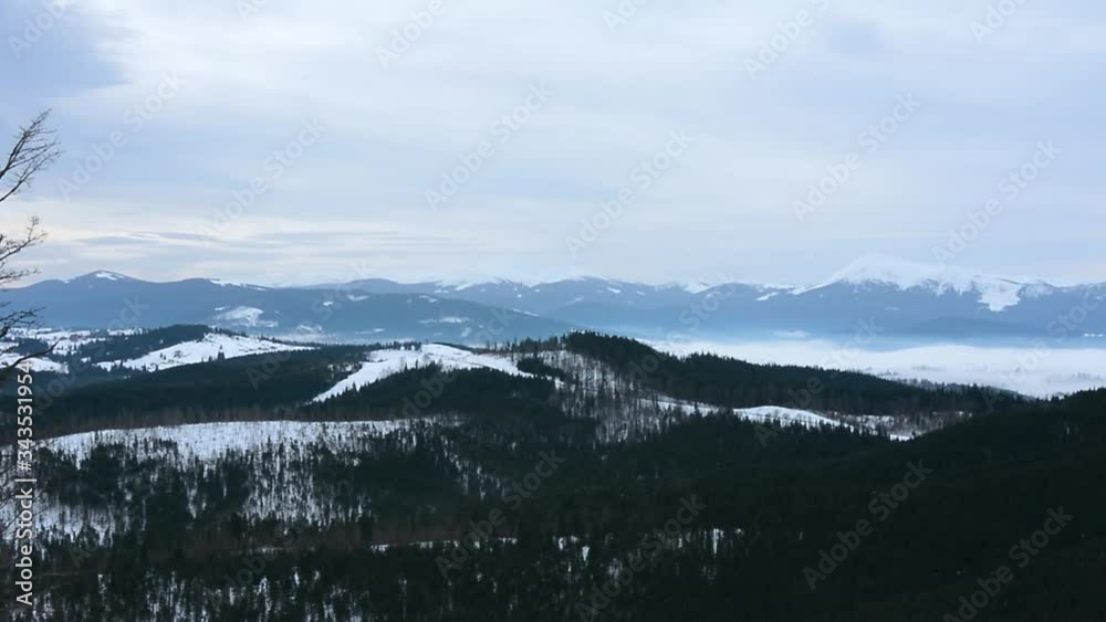 Majestic nature landscape in winter season. Blue mountain range in sunset bright colors. Bukovel Resort, Carpathians, Ukraine. Travel, ski, sports, holidays, recreation. Beauty world. Majestic nature landscape in winter season. Blue mountain range in sunset bright colors. Bukovel Resort, Carpathians, Ukraine. Travel, ski, sports, holidays, recreation. Beauty world.