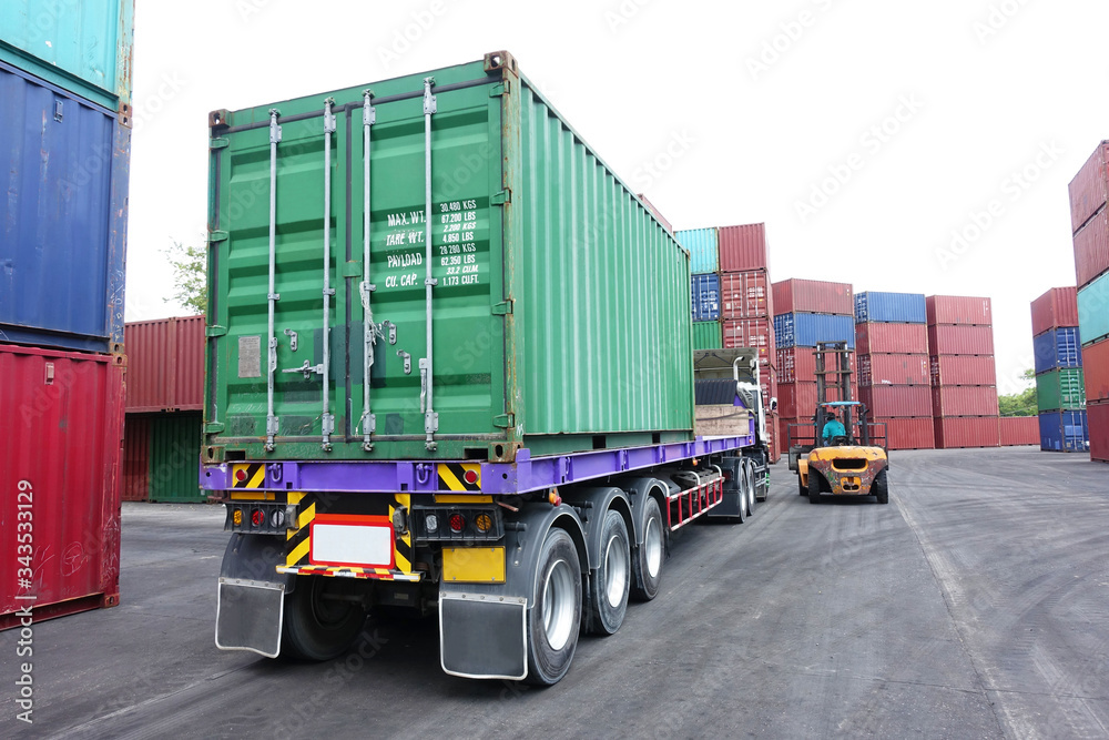 Naklejka premium Delivery truck container is entry into container storage depot as for shipping logistics import & Export concept. 