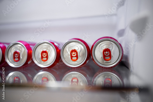 beer in cans lies in the refrigerator