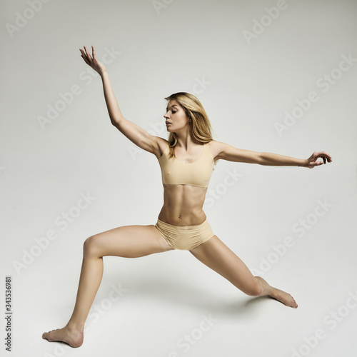 young woman doing yoga (ID: 343536981)