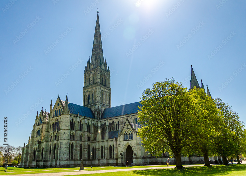 The historic Salisbury Cathedral and its spire on a clear and sunny spring day, Salisbury, Wiltshire, UK