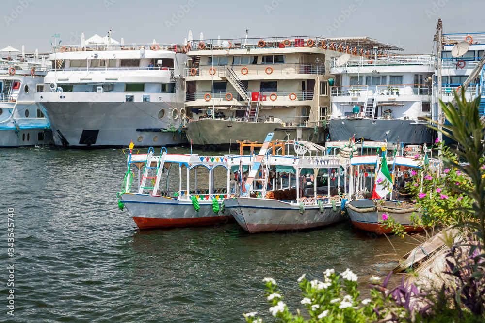 Nile river with sailing boats yachts and ferries doing excursions for tourists in Cairo Egypt 