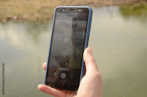 
Family outdoor activities. Smartphone in the hands of a woman.