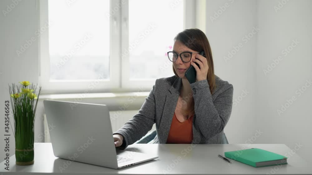 Young woman working at laptop computer in office. Businesswoman or manager job Young woman working at laptop computer in office. Businesswoman or manager job