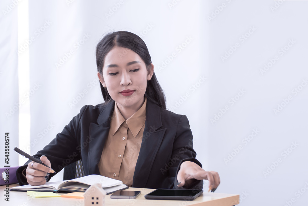 Young business woman is working in the office