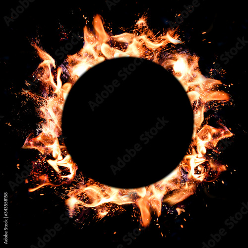Flames of fire round frame on dark background. Copy space, space for text