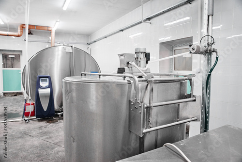 Quadro su tela Automated cow farm, milk tanks
