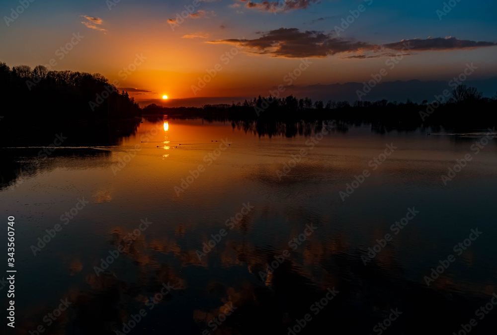 Beautiful sunset with reflections near Ettling, Isar, Bavaria, Germany