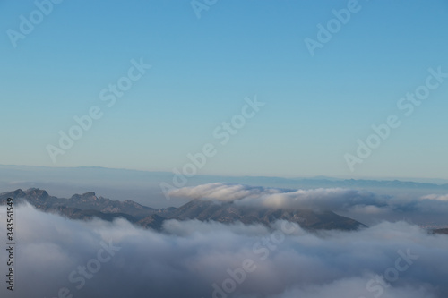 Panoramic view of sea of clouds over mountain peaks © Rafael