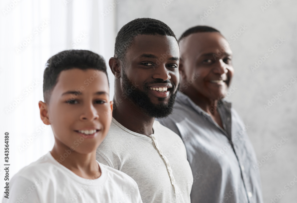 Three Male Generations. Smiling African Son, Father And Grandfather Posing To Camera Three Male Generations. Smiling African Son, Father And Grandfather Posing To Camera