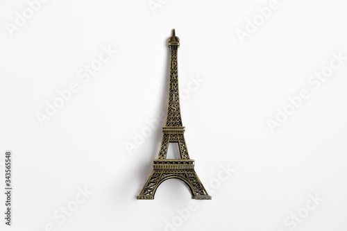 The small Eiffel tower as a souvenir from Paris. Isolated on a white background.High-resolution photo
