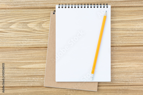 Open spiral notepad and pencil 