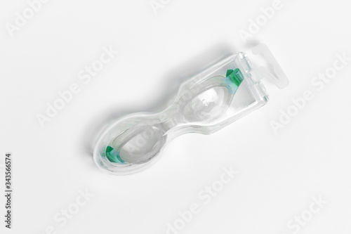 Swimming Goggles in a transparent bag on white background. Protective eyewear swimming glasses.