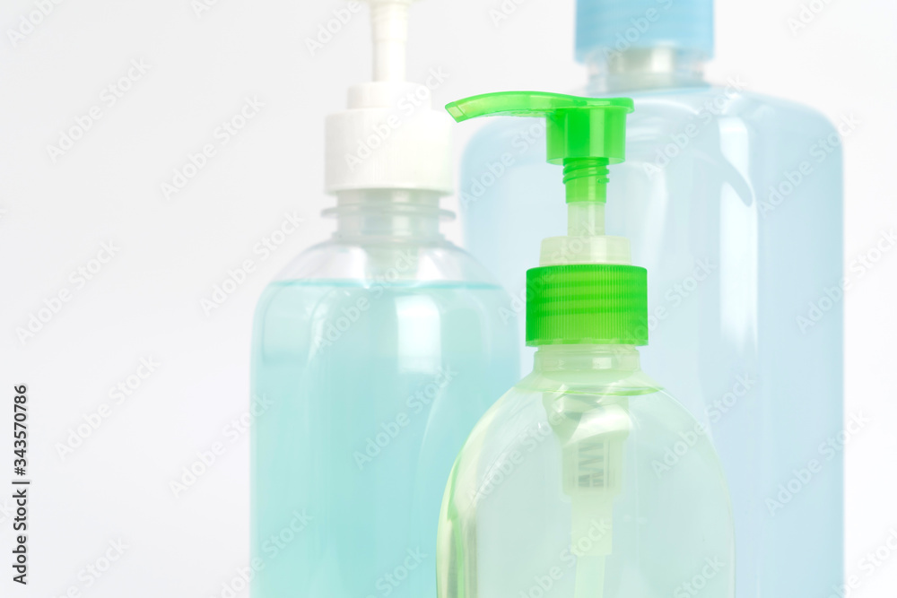 coronavirus (COVID-19) protection blue and green gel sanitizer set, isolated on white background in studio light. coronavirus (COVID-19) protection blue and green gel sanitizer set, isolated on white background in studio light.