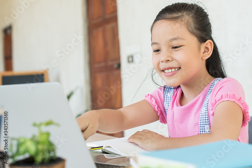 asian girl student online learning study online with video call teacher. social distance during quarantine, self-isolation, online education concept, homeschool, stay at home entertainment.