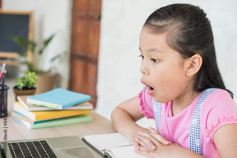 asian girl student online learning study online with video call teacher. social distance during quarantine, self-isolation, online education concept, homeschool, stay at home entertainment. asian girl student online learning study online with video call teacher. social distance during quarantine, self-isolation, online education concept, homeschool, stay at home entertainment.
