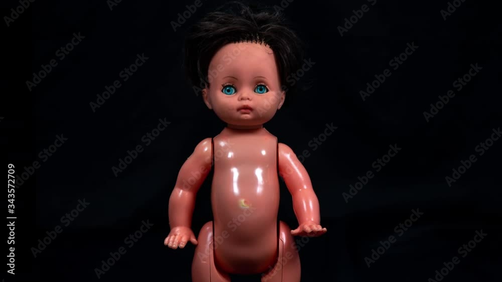 Zooming in and out to plastic doll. Zooming in and out to plastic doll.