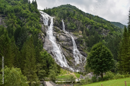 Nardis Waterfall through the green forest in Adamello Brenta Natural Park