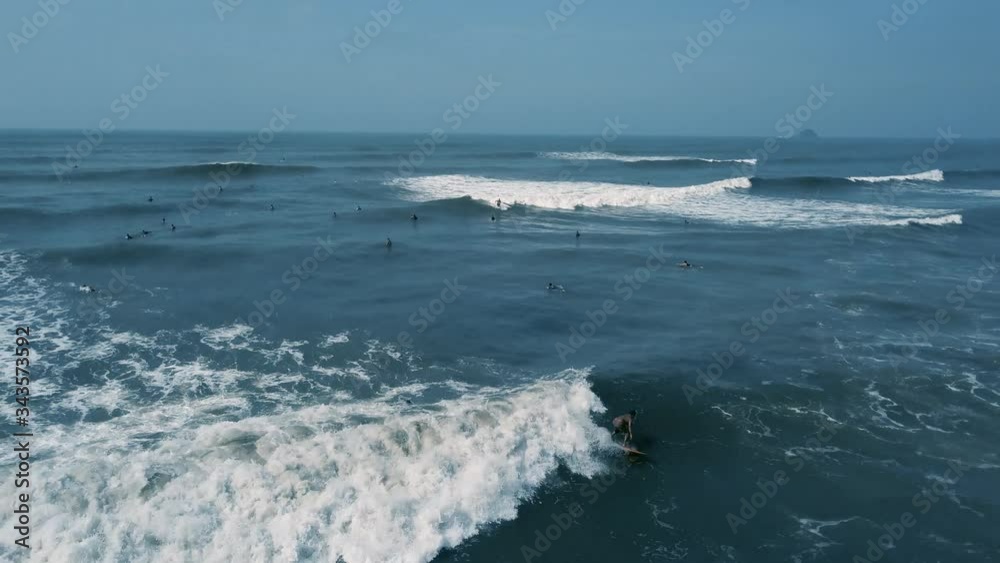 Aerial scene of surfer catching wave on Brazil beach. Aerial scene of surfer catching wave on Brazil beach.