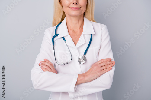 Cropped photo of experienced pensioner retired woman doc cross hands ready consult examine corona virus patient isolated over gray color background