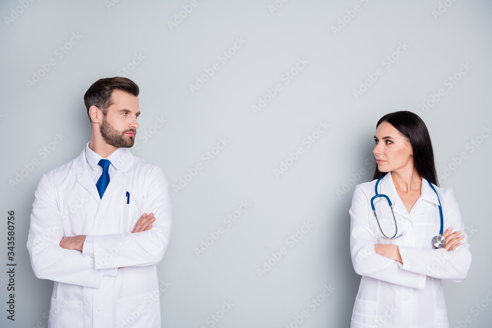 Fototapeta premium Photo of handsome doc guy lady patient consultation virology clinic avoid contact stand meter distance arms crossed experienced doctors wear lab coats isolated grey color background
