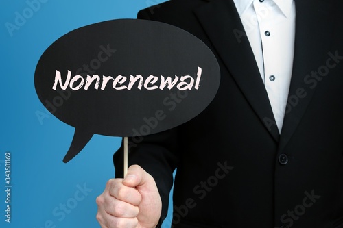 Nonrenewal. Businessman in suit holds speech bubble at camera. The term Nonrenewal is in the sign. Symbol for business, finance, statistics, analysis, economy photo