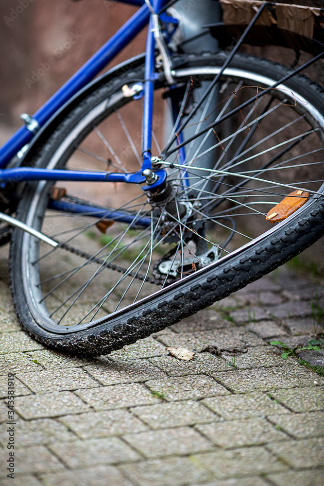 bent rear wheel of an old bicycle bent rear wheel of an old bicycle
