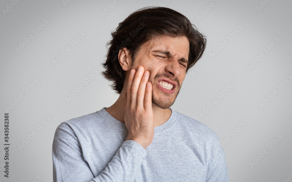 Man suffering from terrible strong teeth pain - obrazy, fototapety, plakaty 