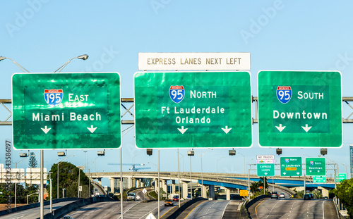 driving the Miami Highway from the airport direction East in Miami, USA. Sunpass lane on left hand side is for toll only. photo