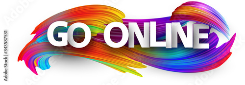 Big white go online sign over brush strokes background.