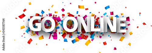 Big white go online sign over confetti background.