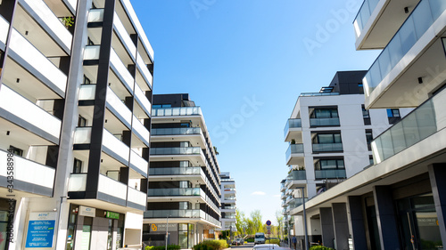 Warsaw, Poland - April 27, 2020: modern apartment buildings in the city. Front view of a modern residential building with balconies and windows.