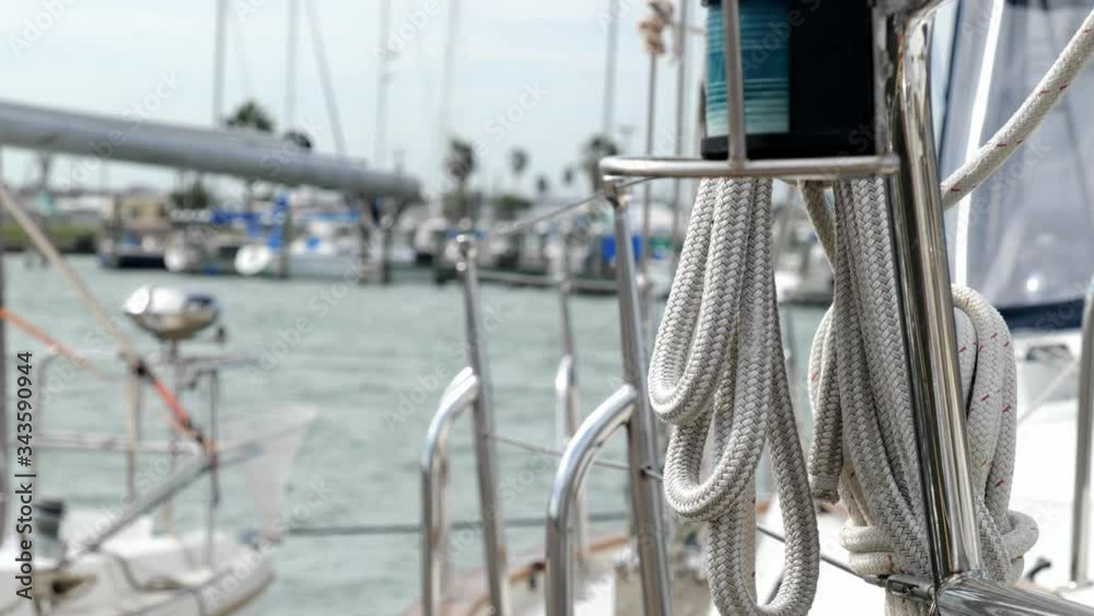 Ropes and other rigging of a sail boat docked in a marina. Selective focus shift with shallow depth of field in handheld clip. Ropes and other rigging of a sail boat docked in a marina. Selective focus shift with shallow depth of field in handheld clip.