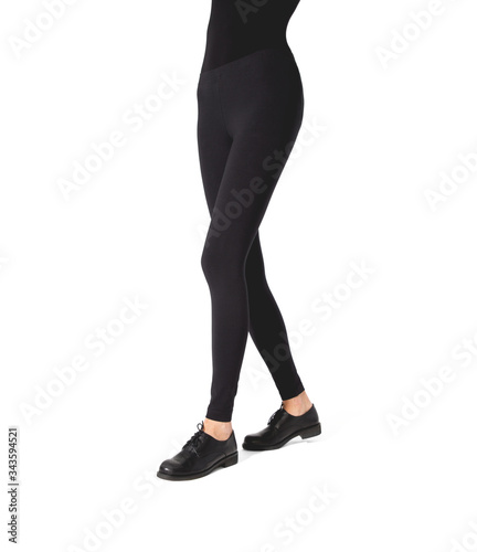 Woman wear black blank leggings mockup, isolated, clipping path. Women in clear leggins template. Cloth pants design presentation. Sport pantaloons stretch tights model wearing. Slim legs in apparel.