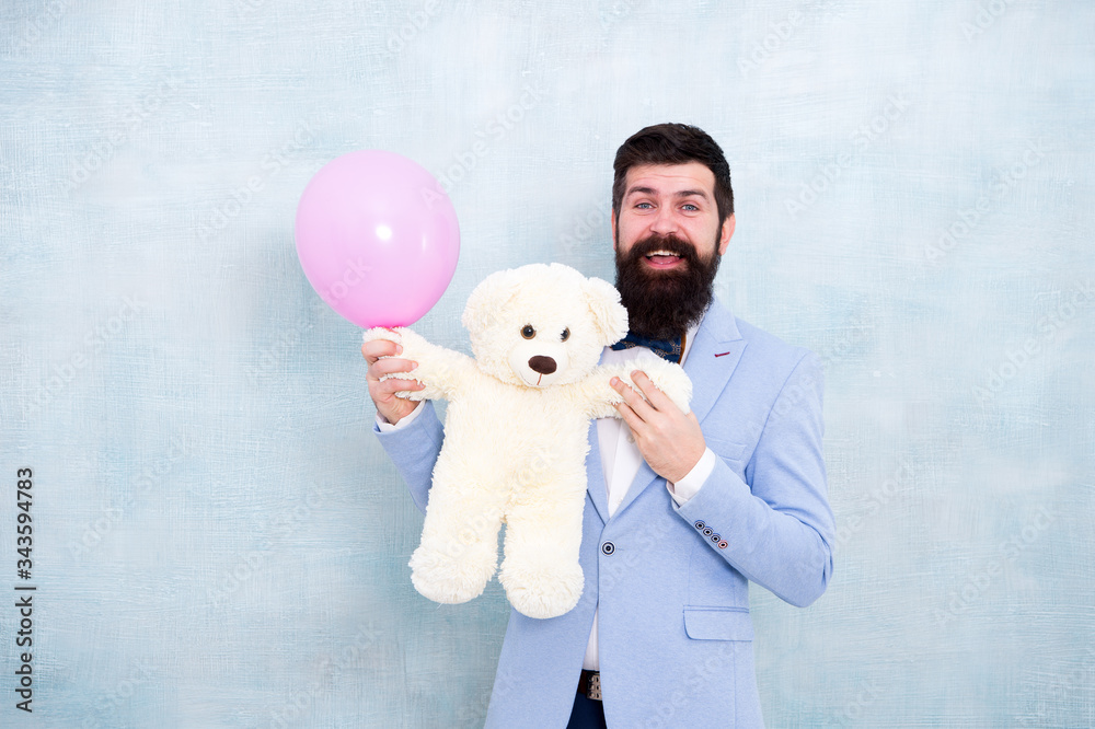 surprise for his girlfriend. Romantic greeting. holiday celebration concept. romantic man in tuxedo bow tie. gift with love. Stereotypical presents. Romantic man with teddy bear and party balloon surprise for his girlfriend. Romantic greeting. holiday celebration concept. romantic man in tuxedo bow tie. gift with love. Stereotypical presents. Romantic man with teddy bear and party balloon