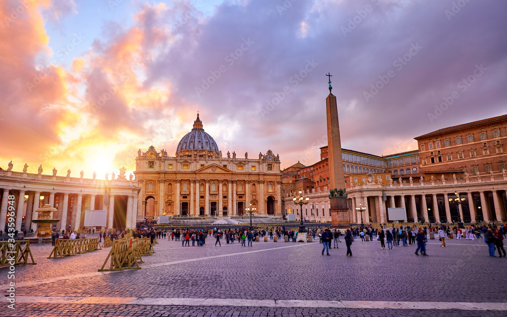 Vatican City Holy( See). Rome, Italy. Dome of St. Peters Basil cathedral at Saint Peters Square. Evening sunset, golden hour with evening sky and street lamps.
