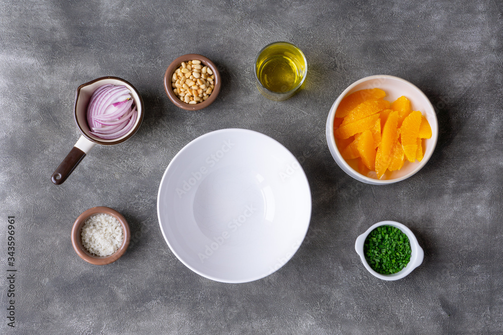 Preparing to make orange salad. All ingredients are ready on the table. Vegetarian, vegan lunch, snack or dinner. Preparing to make orange salad. All ingredients are ready on the table. Vegetarian, vegan lunch, snack or dinner.